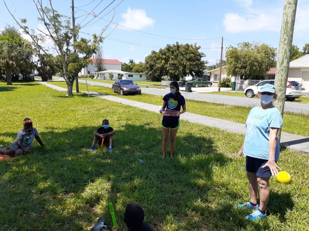 Volunteers leading an outdoor games session with students