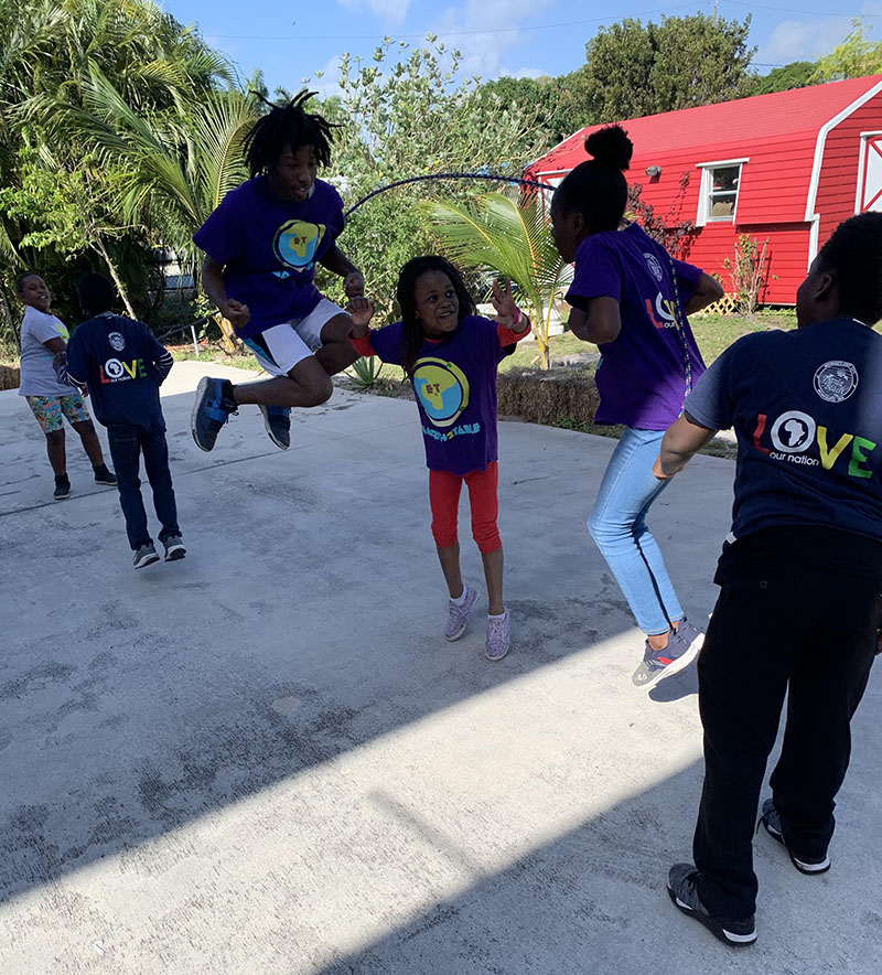 Students jumping rope outdoors after school