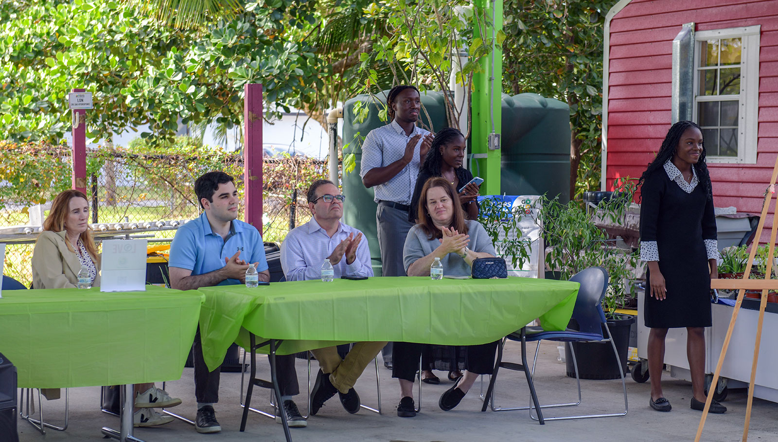 Community partners and guests at a Love Our Nation outdoor presentation