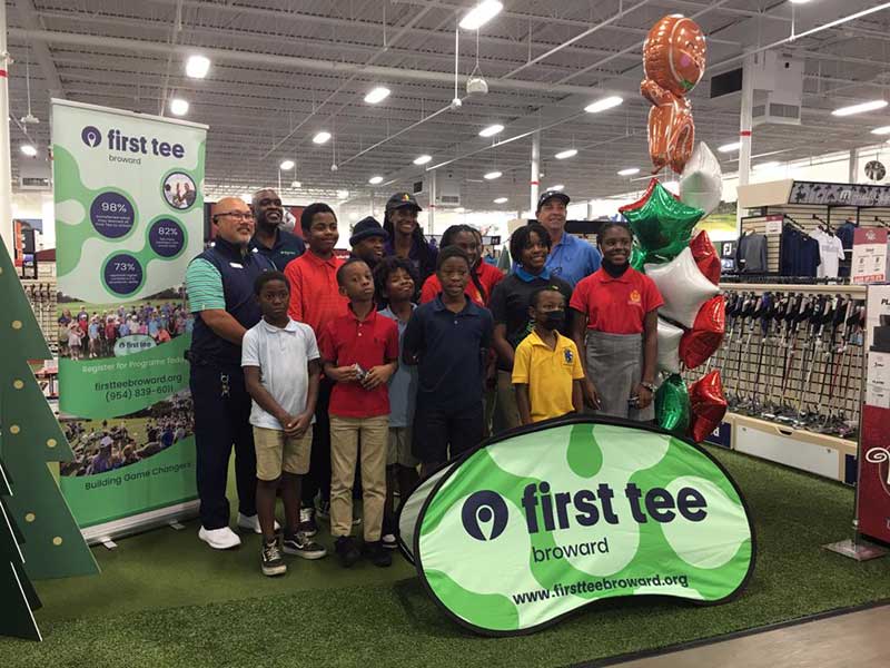 Students and coaches at a First Tee Broward golf event